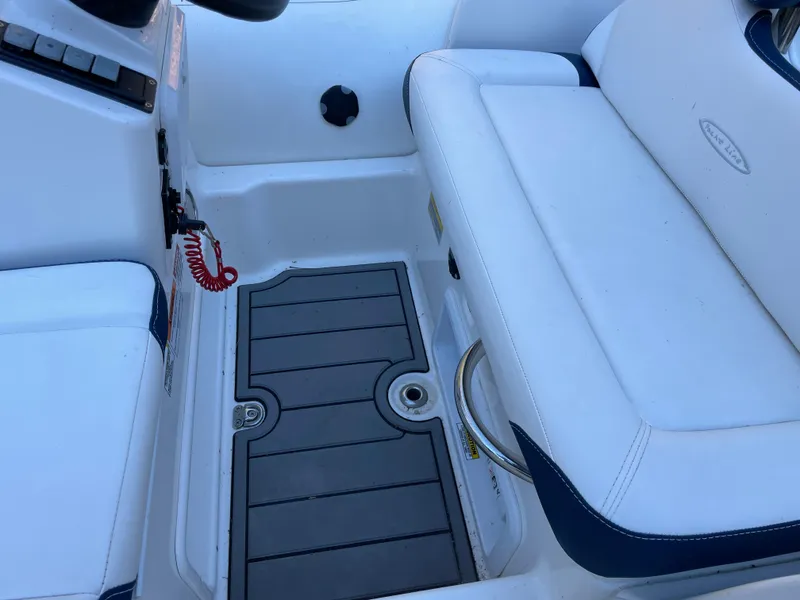 Slide: The Image of 2022 Zodiac Yachtline 360 interior with white seating and non-slip flooring. - 10