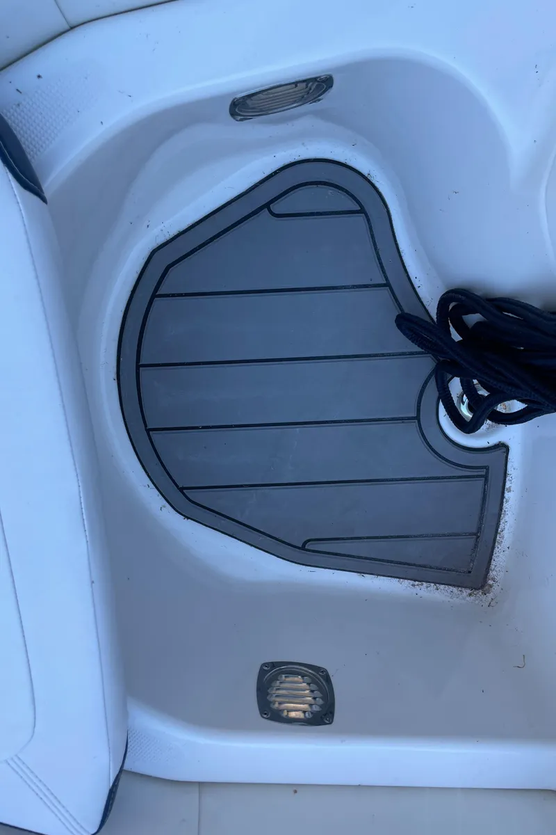 Slide: The Image of Zodiac Yachtline 360, 2022 model, deck area with non-slip mat and coiled rope. - 13