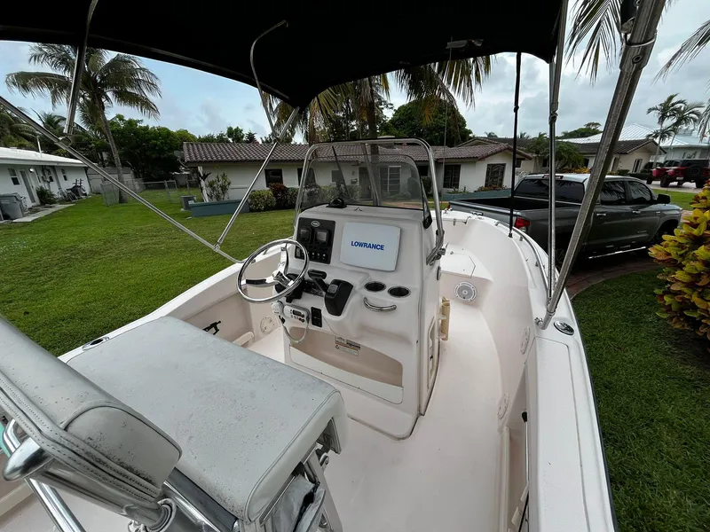 Slide: The Image of 2013 Grady-White Fisherman 180 boat interior with steering console and Lowrance display. - 23