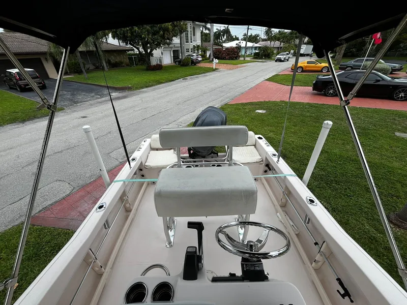 Slide: The Image of 2013 Grady-White Fisherman 180 boat interior with steering wheel, parked in residential area. - 26