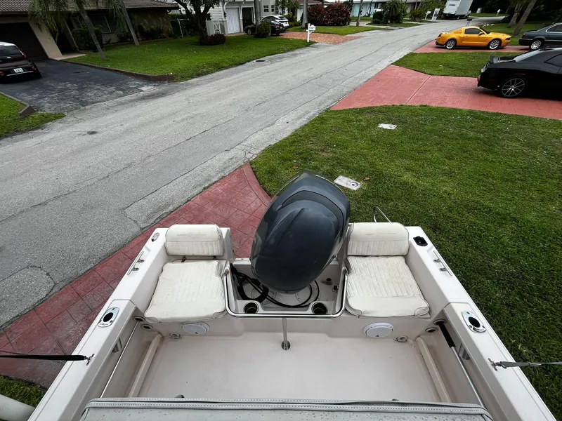 Slide: The Image of 2013 Grady-White Fisherman 180 boat with outboard motor, parked in residential area. - 27