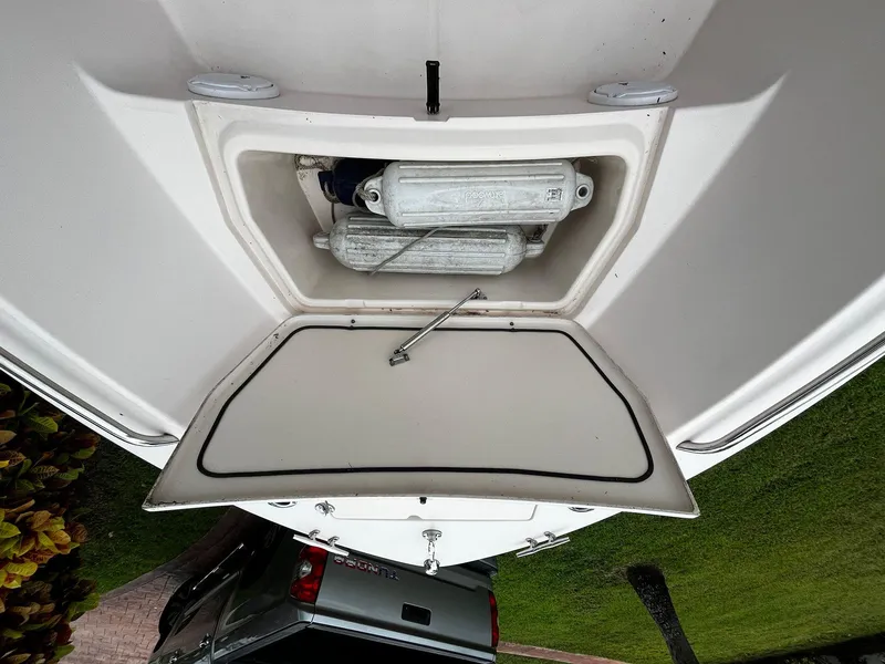 Slide: The Image of 2013 Grady-White Fisherman 180 storage compartment with equipment inside, viewed from above. - 37