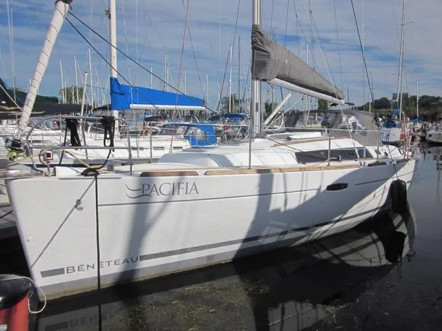 Slide: The Image of 2009 Beneteau Oceanis 34 sailboat docked in a marina. - 0