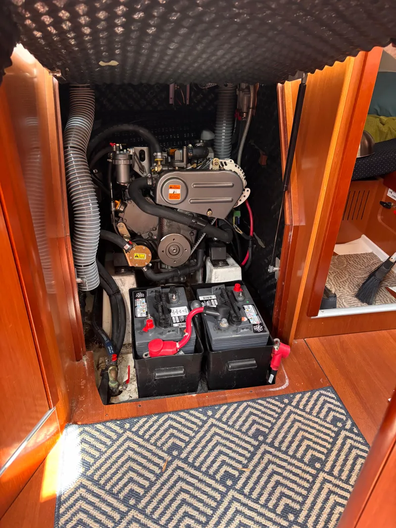 Slide: The Image of Engine compartment of 2009 Beneteau Oceanis 34 sailboat with visible batteries. - 11