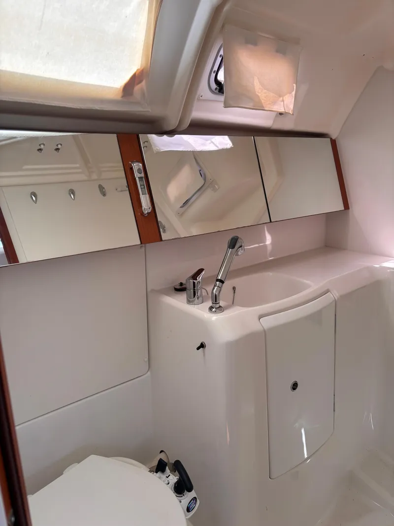 Slide: The Image of Bathroom interior of 2009 Beneteau Oceanis 34 yacht, featuring sink and mirror. - 12