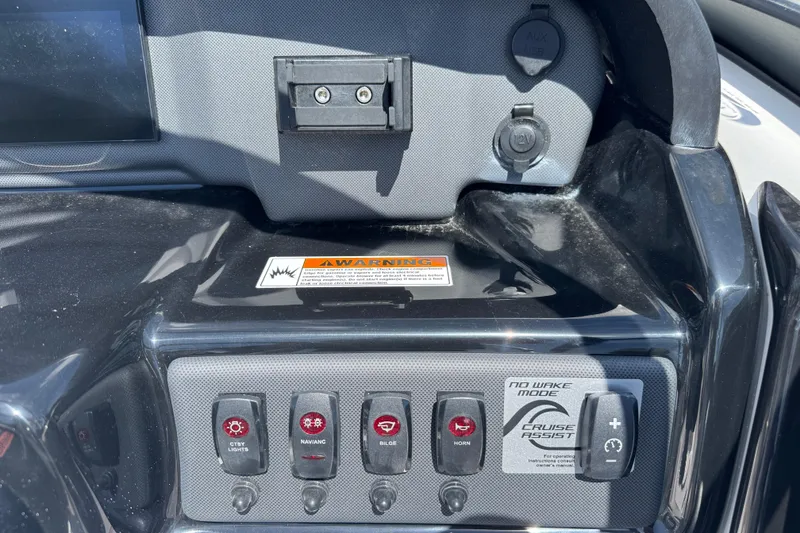 Slide: The Image of Control panel of 2025 Yamaha Boats SX190 with switches and cruise assist feature. - 17