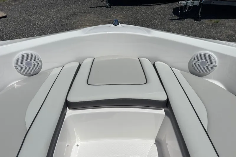 Slide: The Image of 2025 Yamaha Boats SX190 interior with cushioned seating and built-in speakers. - 7