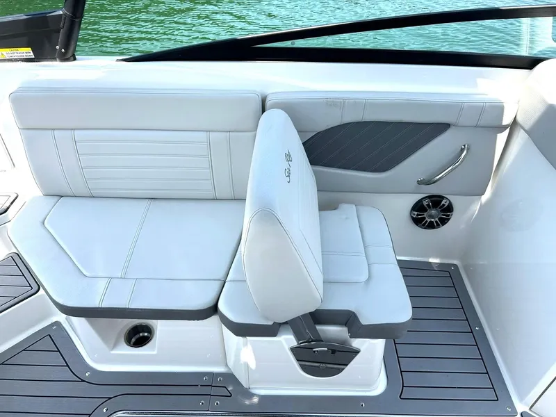 Slide: The Image of 2020 Sea Ray SPX 230 boat interior with white seating and sleek design. - 36