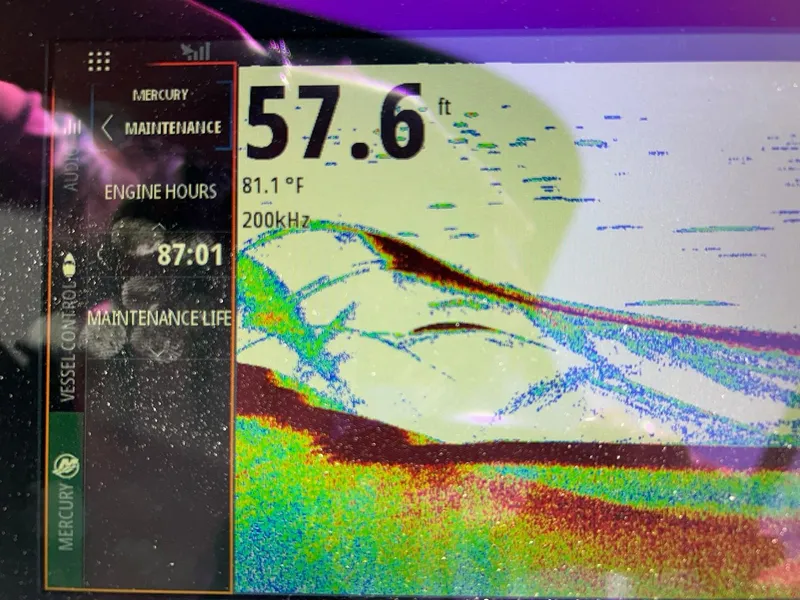 Slide: The Image of Sonar display showing depth of 57.6 feet on a 2020 Sea Ray SPX 230 boat. - 42