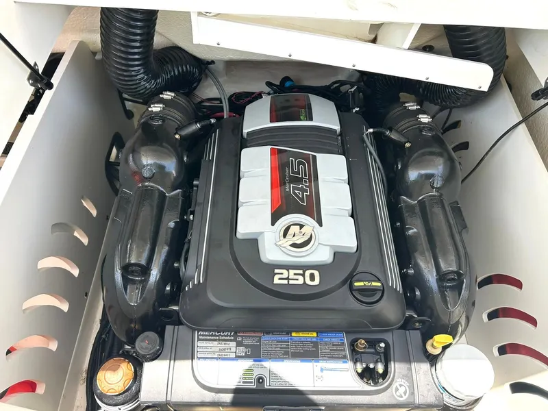 Slide: The Image of Engine compartment of a 2020 Sea Ray SPX 230 boat, featuring a 4.5L 250 HP engine. - 43