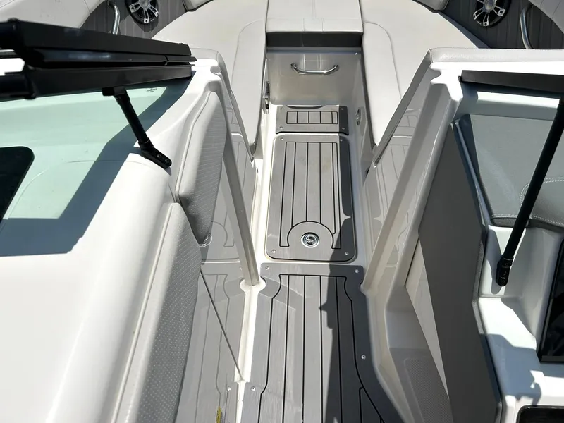Slide: The Image of 2020 Sea Ray SPX 230 boat interior with sleek gray flooring and seating. - 46