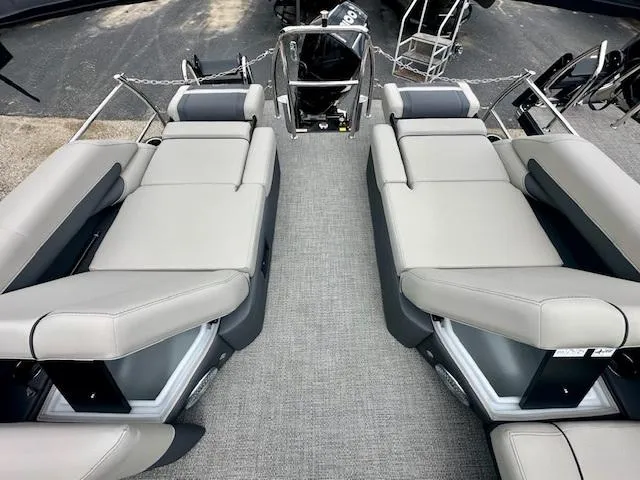 Slide: The Image of 2025 Barletta C24M pontoon boat with spacious seating and modern design. - 14