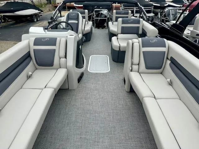 Slide: The Image of 2025 Barletta C24M pontoon boat interior with spacious seating and modern design. - 3