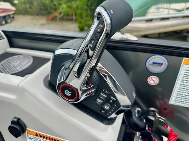 Slide: The Image of Throttle control of 2025 Barletta C24M boat with start button and warning labels. - 6