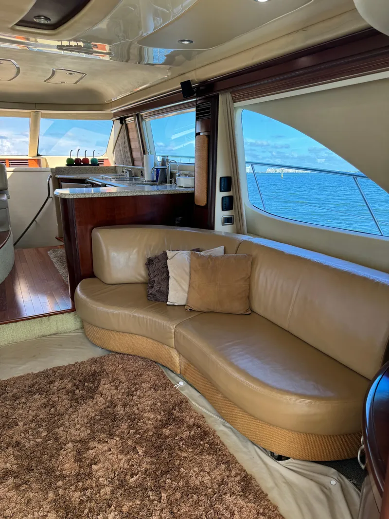 Slide: The Image of Luxurious interior of 2005 Sea Ray 58 Sedan Bridge yacht with leather seating and ocean view. - 36