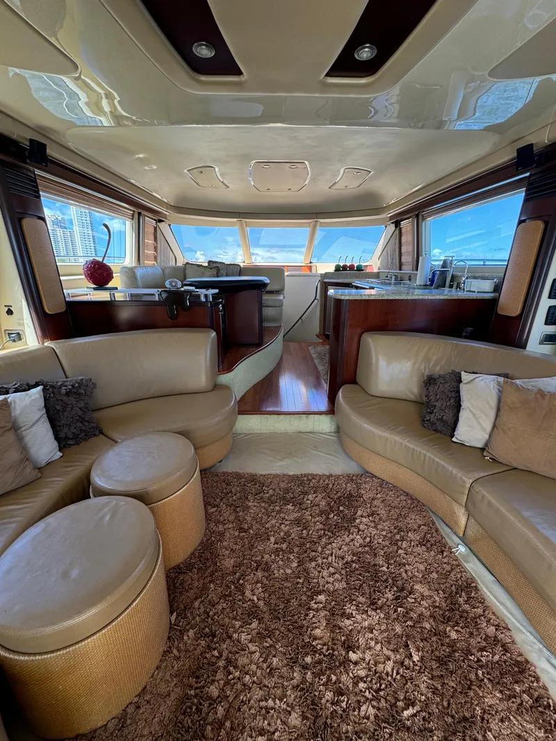 Slide: The Image of Luxurious interior of a 2005 Sea Ray 58 Sedan Bridge yacht with plush seating. - 37