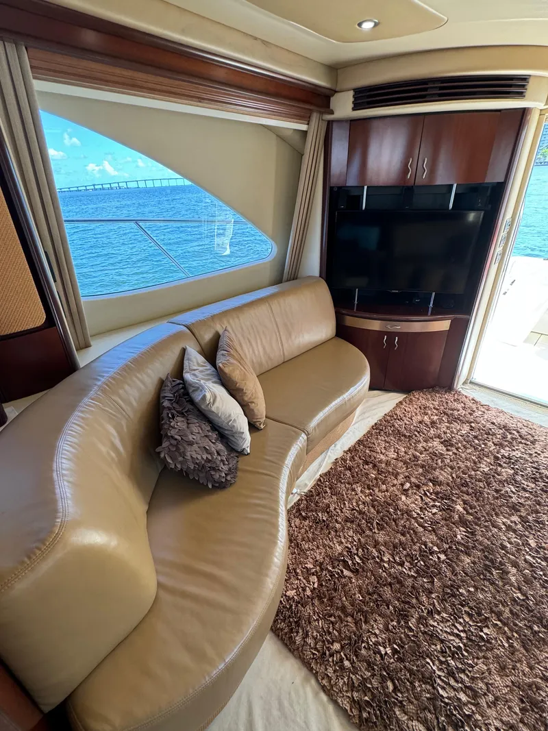 Slide: The Image of Luxurious interior of 2005 Sea Ray 58 Sedan Bridge yacht with leather seating and ocean view. - 38