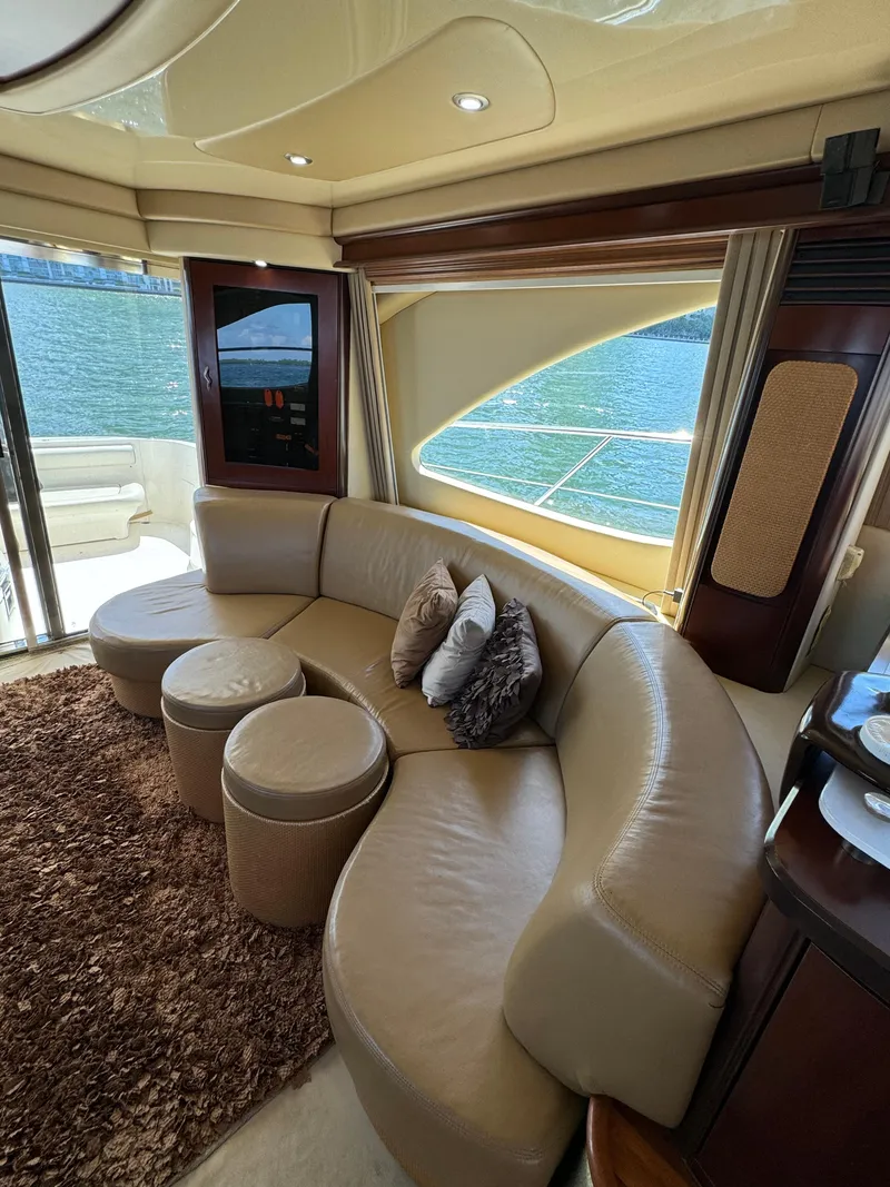 Slide: The Image of Luxurious interior of 2005 Sea Ray 58 Sedan Bridge yacht with plush seating and elegant decor. - 39