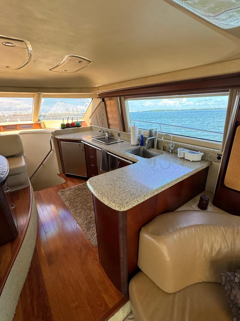 Slide: The Image of Luxurious interior of a 2005 Sea Ray 58 Sedan Bridge yacht with ocean view. - 41