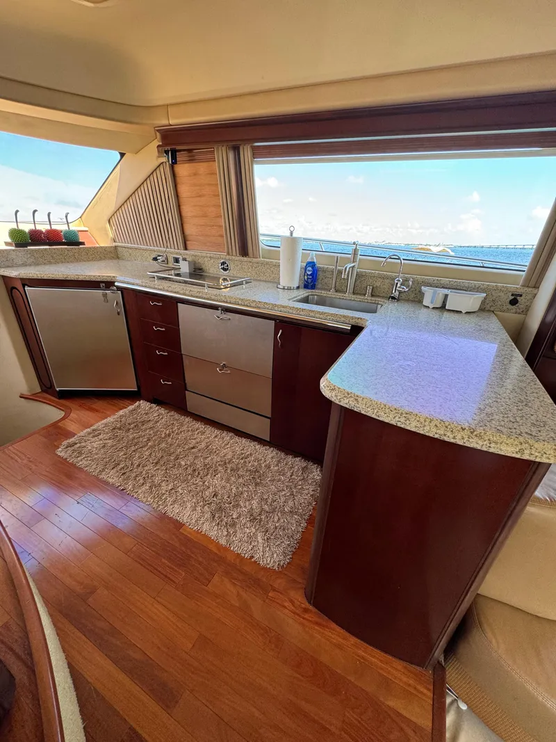 Slide: The Image of Luxurious kitchen interior of 2005 Sea Ray 58 Sedan Bridge yacht with ocean view. - 43