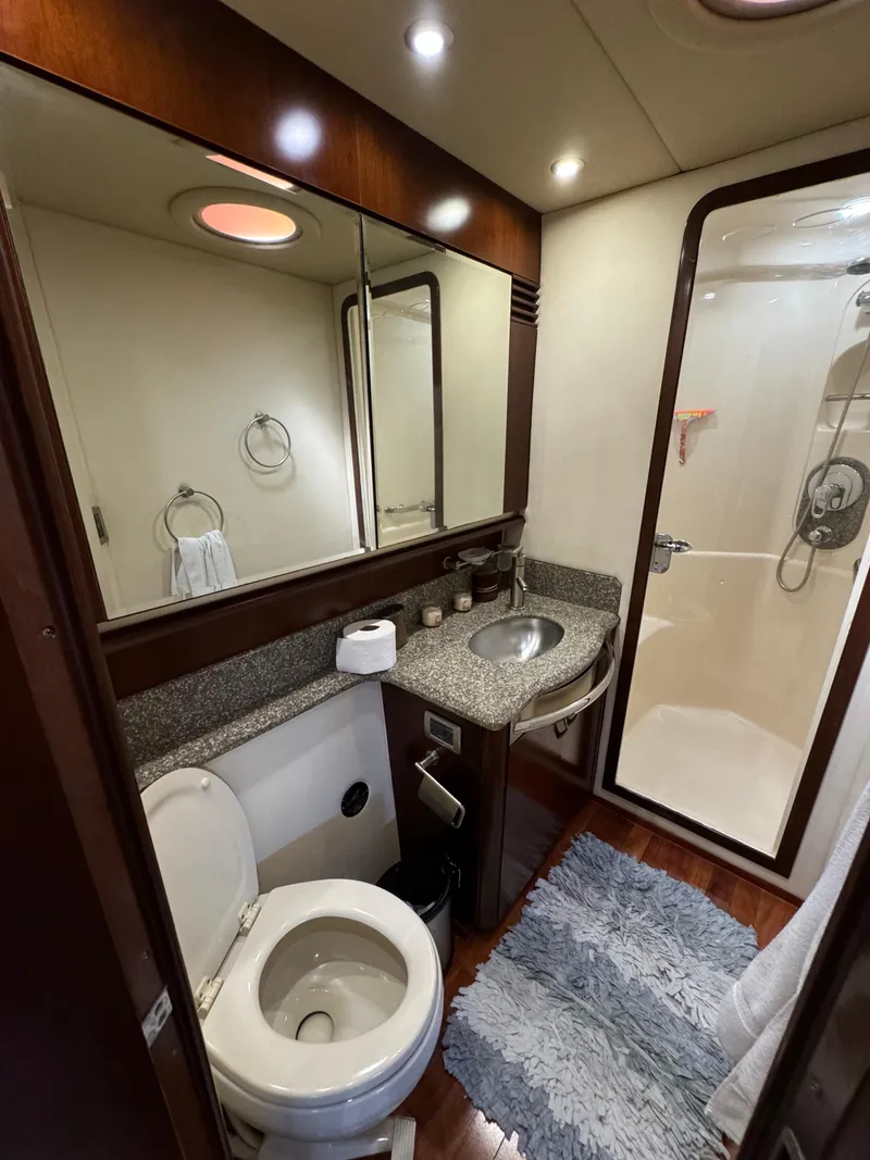 Slide: The Image of Luxurious bathroom in 2005 Sea Ray 58 Sedan Bridge yacht with modern amenities. - 44