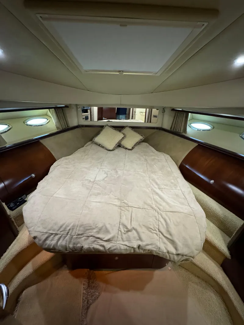 Slide: The Image of Luxurious bedroom interior of 2005 Sea Ray 58 Sedan Bridge yacht with plush bedding. - 45