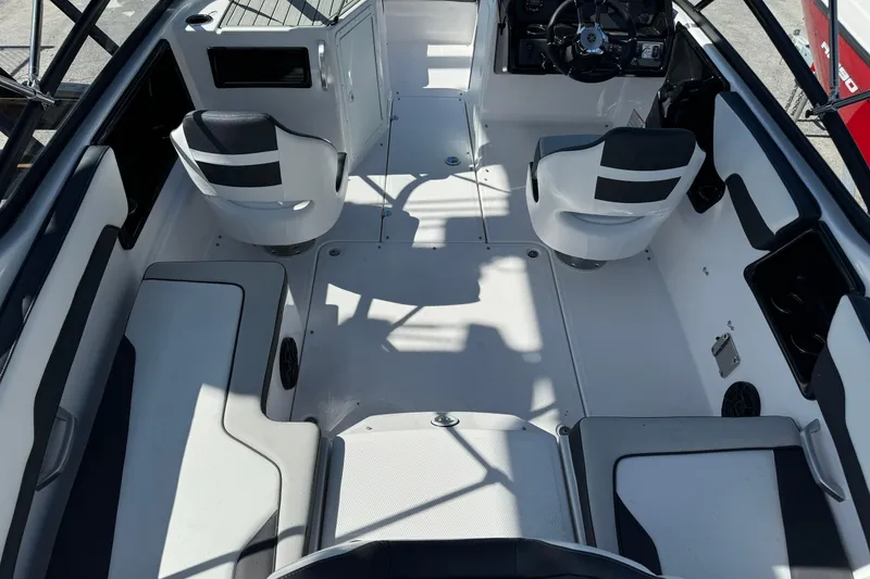 Slide: The Image of 2025 Yamaha Boats SX195 interior with modern seating and sleek design. - 19