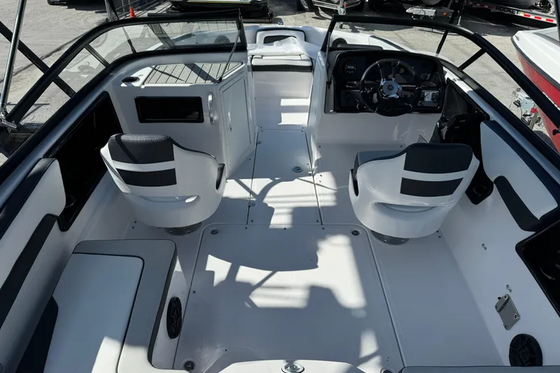 Slide: The Image of 2025 Yamaha Boats SX195 interior with modern seating and sleek dashboard design. - 20