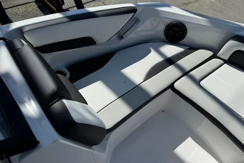 Slide: The Image of 2025 Yamaha Boats SX195 interior seating with black and white upholstery. - 23