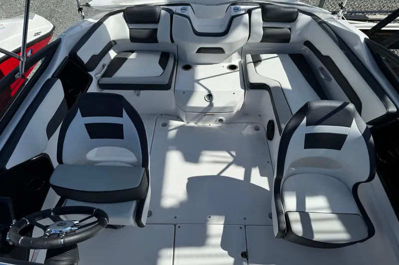 Slide: The Image of 2025 Yamaha Boats SX195 interior with modern seating and steering wheel. - 27