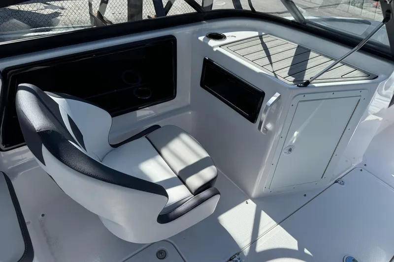 Slide: The Image of 2025 Yamaha Boats SX195 interior with sleek seating and modern dashboard design. - 28