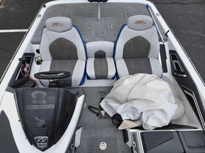 Slide: The Image of 2015 Skeeter FX 20 boat interior with dual seats and steering console. - 20