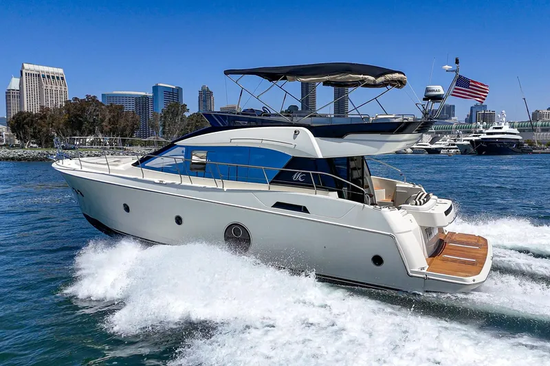 Slide: The Image of 2017 Beneteau Monte Carlo 5 MC5 yacht cruising near city skyline. - 13