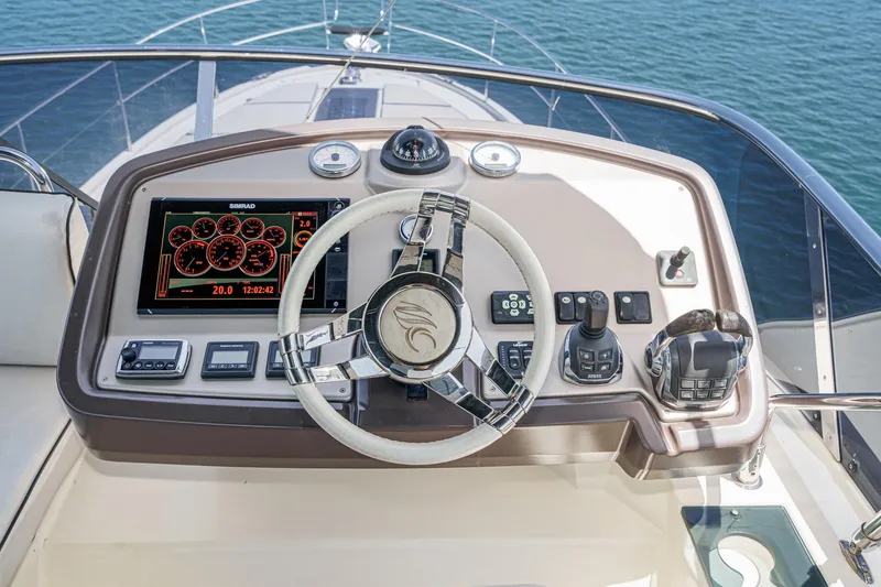 Slide: The Image of Helm of 2017 Beneteau Monte Carlo 5 MC5 yacht with modern controls and navigation display. - 23