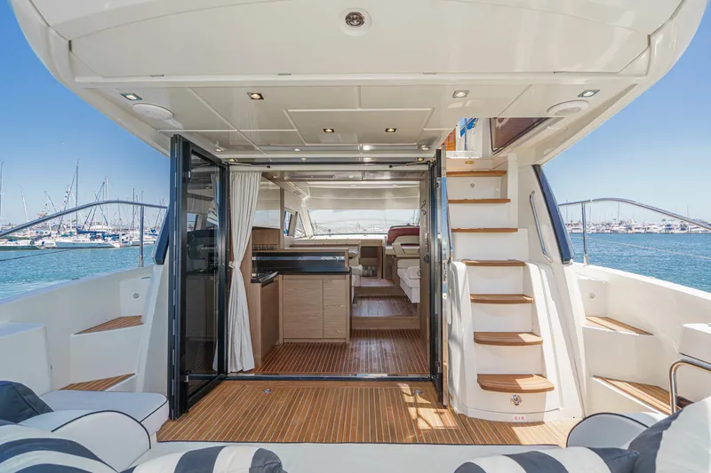 Slide: The Image of 2017 Beneteau Monte Carlo 5 MC5 yacht interior with open deck, modern design, and ocean view. - 29