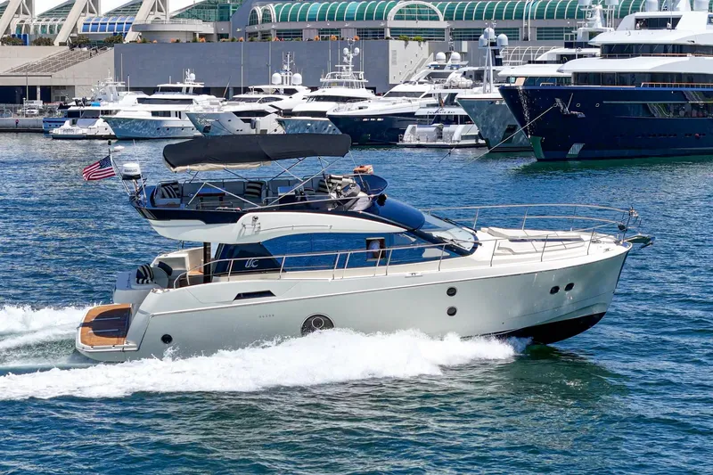 Slide: The Image of 2017 Beneteau Monte Carlo 5 MC5 yacht cruising in a marina with other boats. - 3