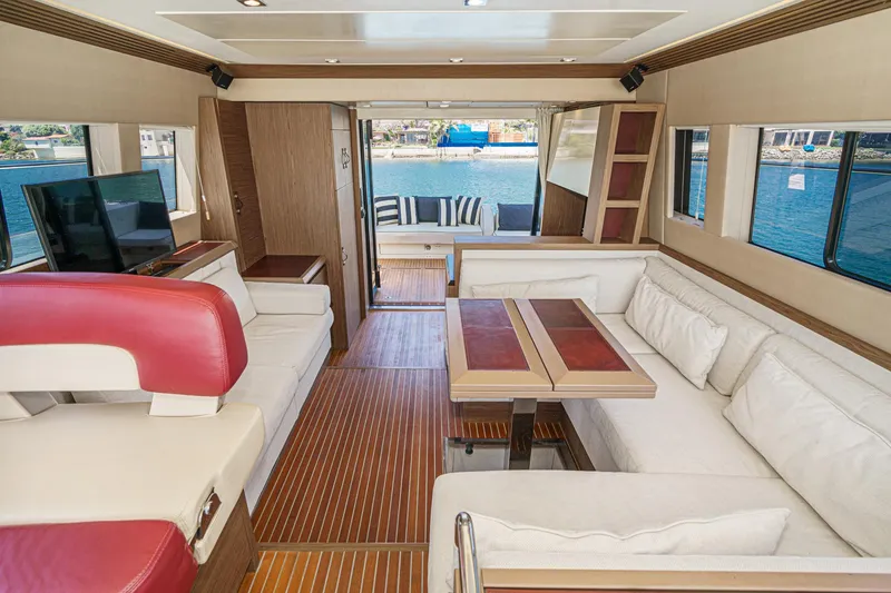Slide: The Image of Luxurious interior of 2017 Beneteau Monte Carlo 5 MC5 yacht with elegant seating and wood finishes. - 37