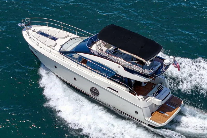 Slide: The Image of 2017 Beneteau Monte Carlo 5 MC5 yacht cruising on open water. - 4