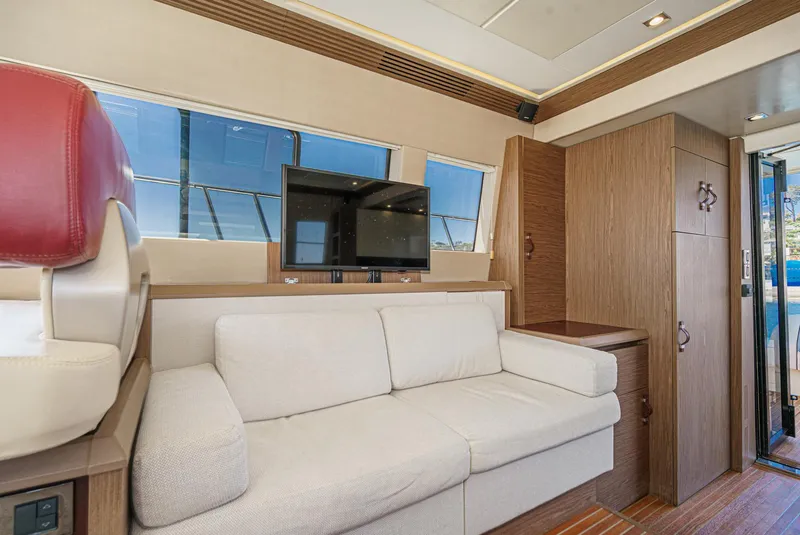 Slide: The Image of Luxurious interior of 2017 Beneteau Monte Carlo 5 MC5 yacht with sofa and TV. - 40