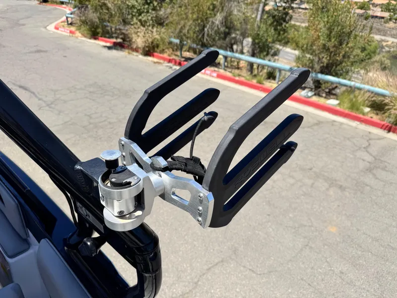 Slide: The Image of Wakeboard rack on a 2020 Moomba Max boat, mounted on a sunny day. - 10