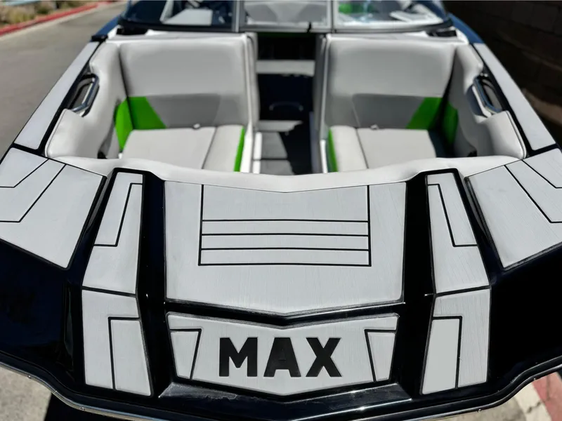 Slide: The Image of 2020 Moomba Max boat interior with gray and green seating, showcasing modern design. - 11
