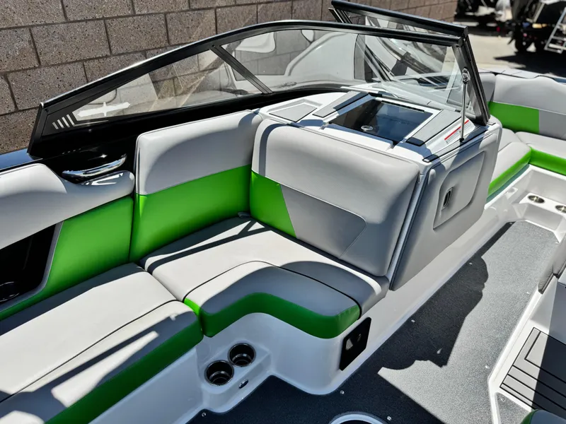 Slide: The Image of 2020 Moomba Max boat interior with green and gray seating, modern design. - 24