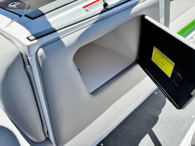 Slide: The Image of 2020 Moomba Max boat storage compartment with open hatch, showcasing interior space. - 26