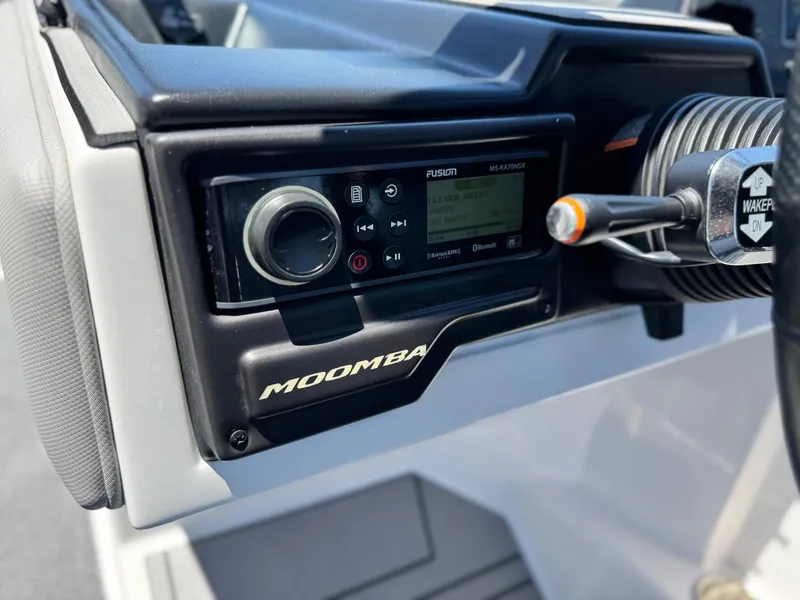 Slide: The Image of 2020 Moomba Max boat dashboard with Fusion audio system and controls. - 31