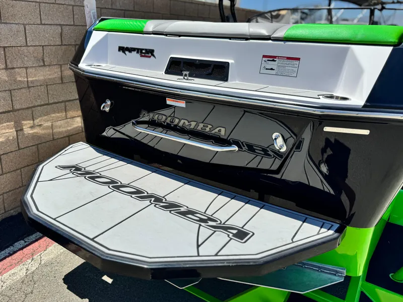 Slide: The Image of 2020 Moomba Max boat rear view with swim platform and Raptor branding. - 6