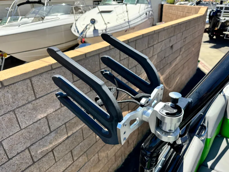 Slide: The Image of Wakeboard rack on a 2020 Moomba Max boat, with other boats in the background. - 9