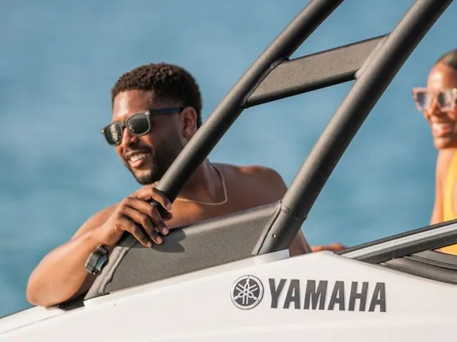 Slide: The Image of Man enjoying a ride on a 2025 Yamaha SX195 boat in sunny weather. - 20