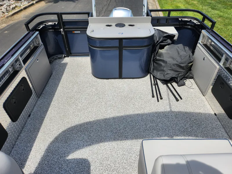 Slide: The Image of 2023 Qwest 8522 Pro Family Fish boat interior with spacious deck and seating. - 14