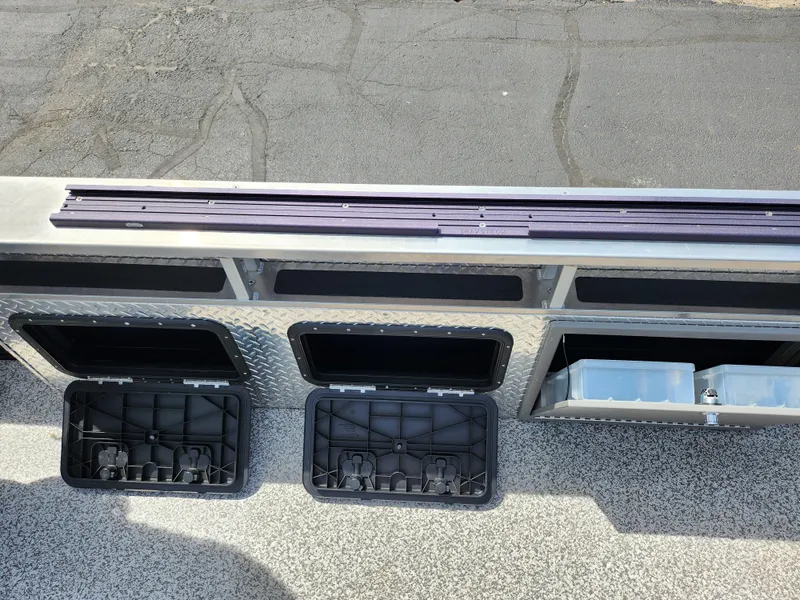 Slide: The Image of 2023 Qwest 8522 Pro Family Fish boat storage compartments and deck view. - 16