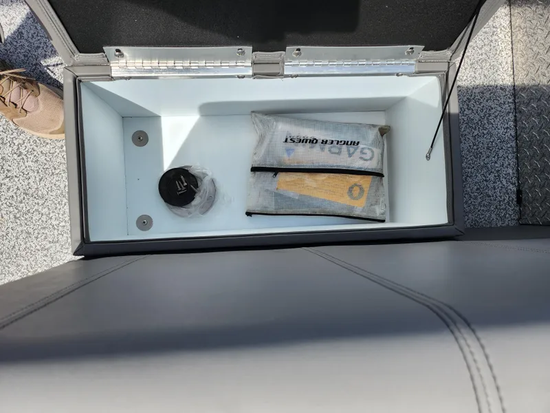 Slide: The Image of 2023 Qwest 8522 Pro Family Fish storage compartment with fishing gear and accessories. - 19